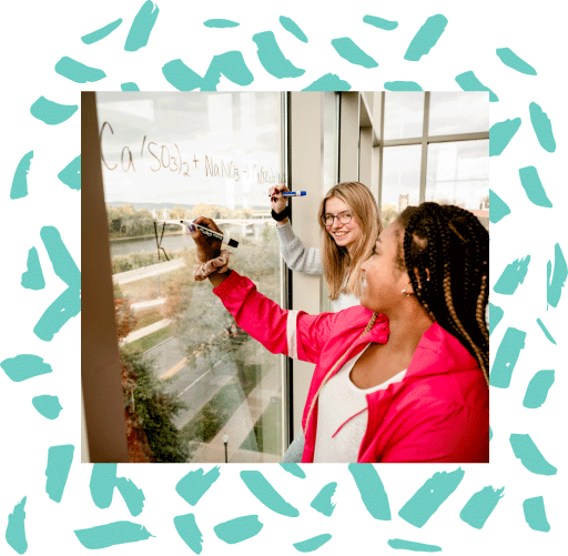 students writing calculations on window