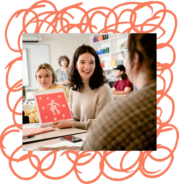 female students sharing artwork